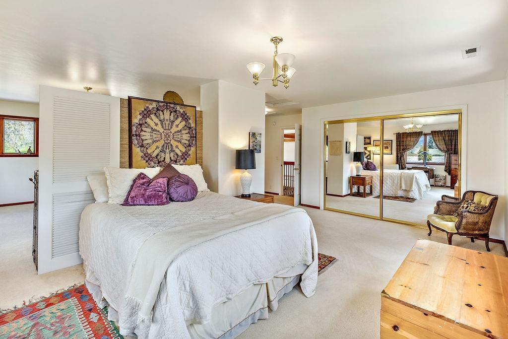 2076 Upper Applegate Road Jacksonville, OR 97530 - Photo 32 of 35 a bedroom with a bed and ceiling fan