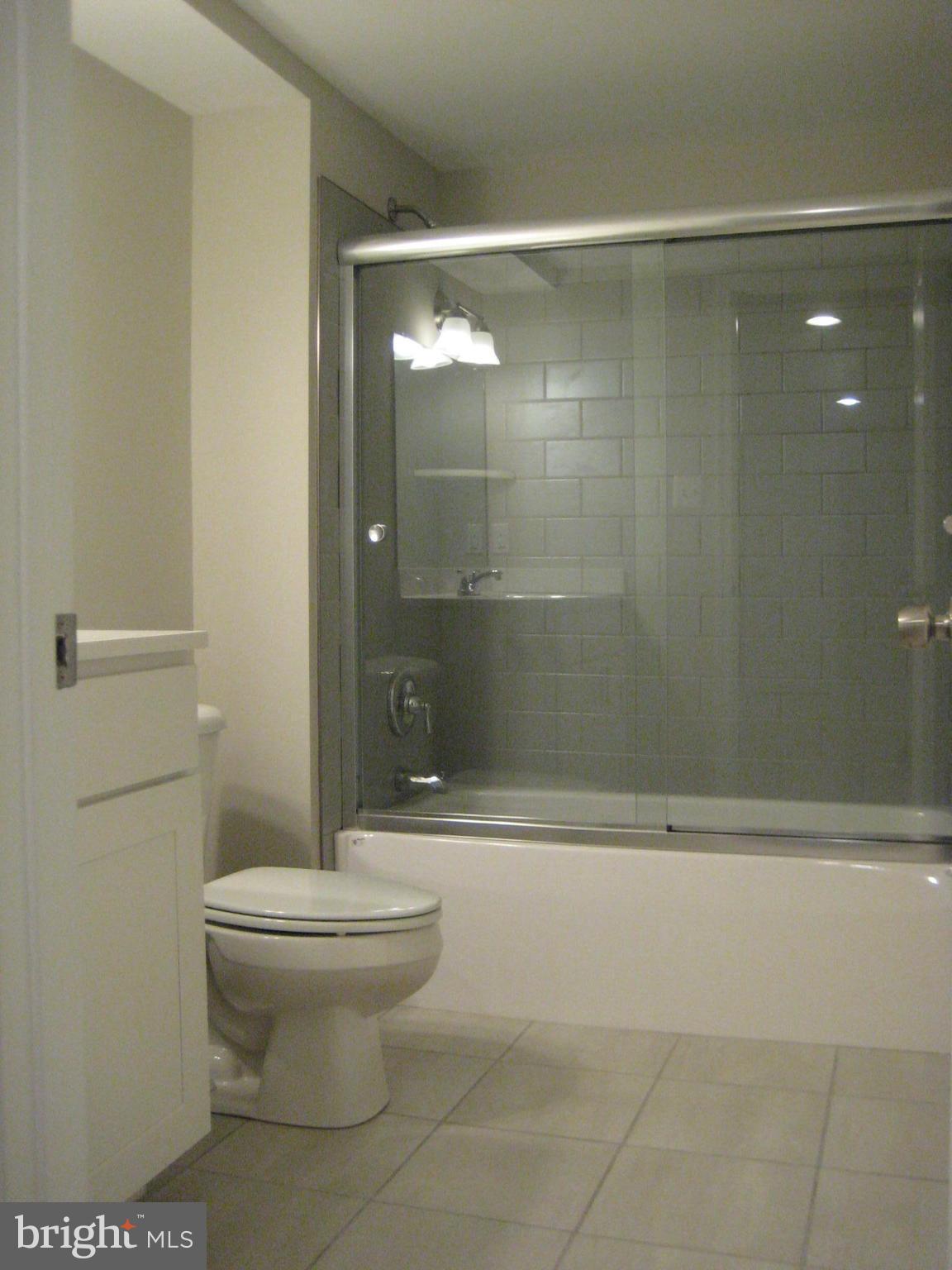 27512 Ridge Road Damascus, MD 20872 - Photo 4 of 17 UPGRADE TILE-FIXTURES AND CUSTOM SHOWER DOOR