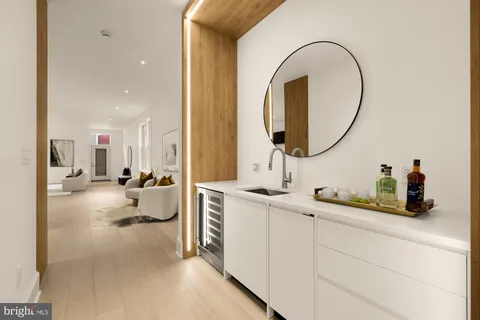 a kitchen with stainless steel appliances a sink and a refrigerator