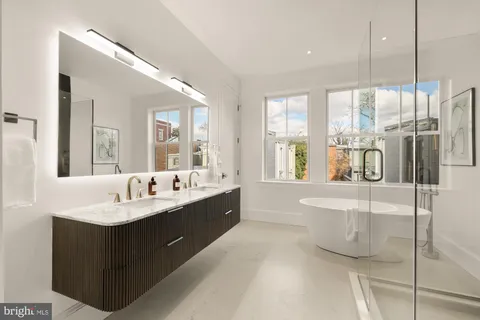 a bathroom with a shower and a mirror