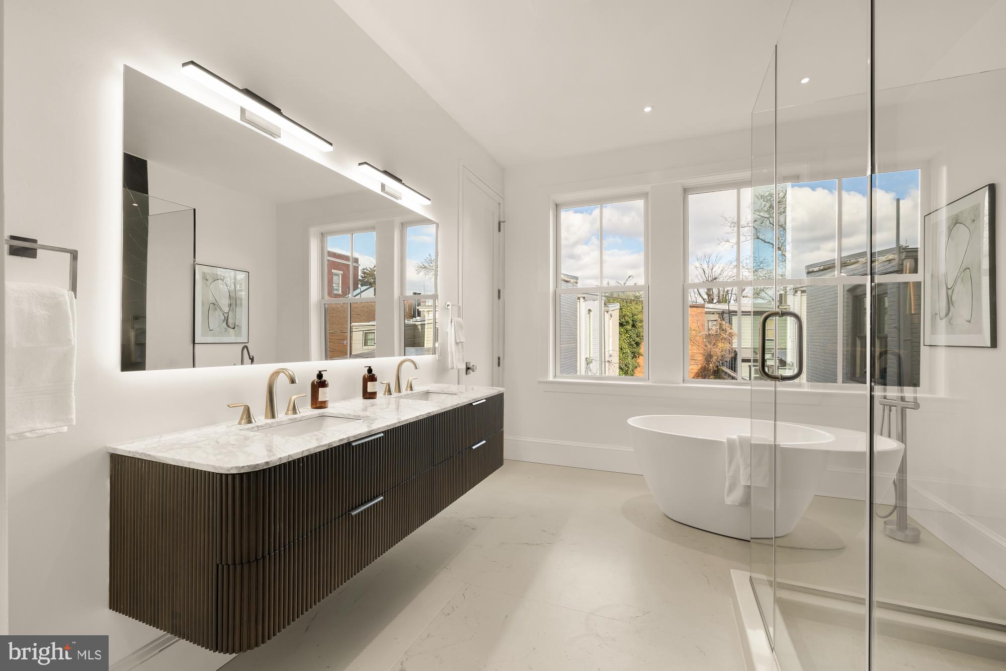 329 8th Street Northeast Washington, DC 20002 - Photo 25 of 51 a bathroom with a tub sink and mirror