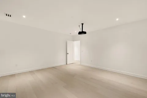 a bathroom with a sink mirror toilet and bathtub