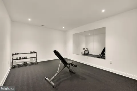 a bedroom with a bed and a potted plant