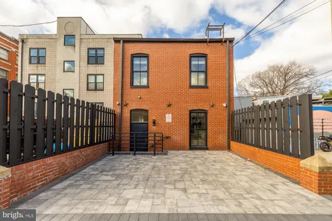 an aerial view of a brick building