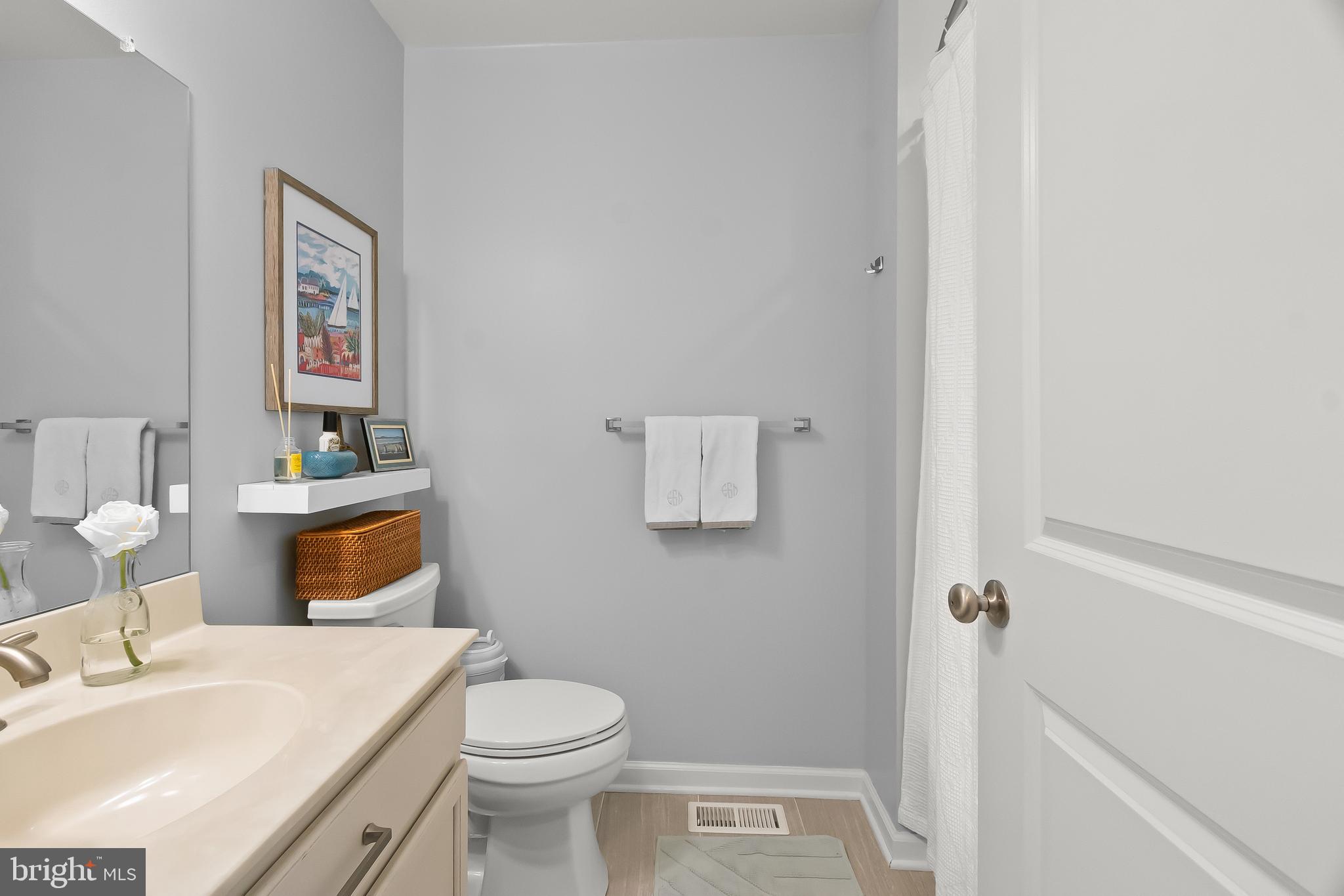 527 Jacobsen Drive Newark, DE 19702 - Photo 36 of 60 a white toilet sitting next to a bathroom sink