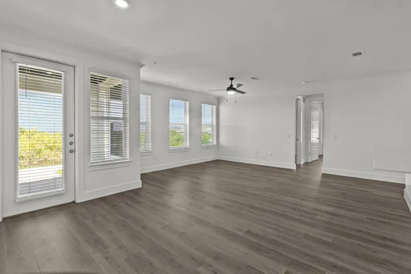 a view of kitchen with kitchen island wooden floor center island and appliances
