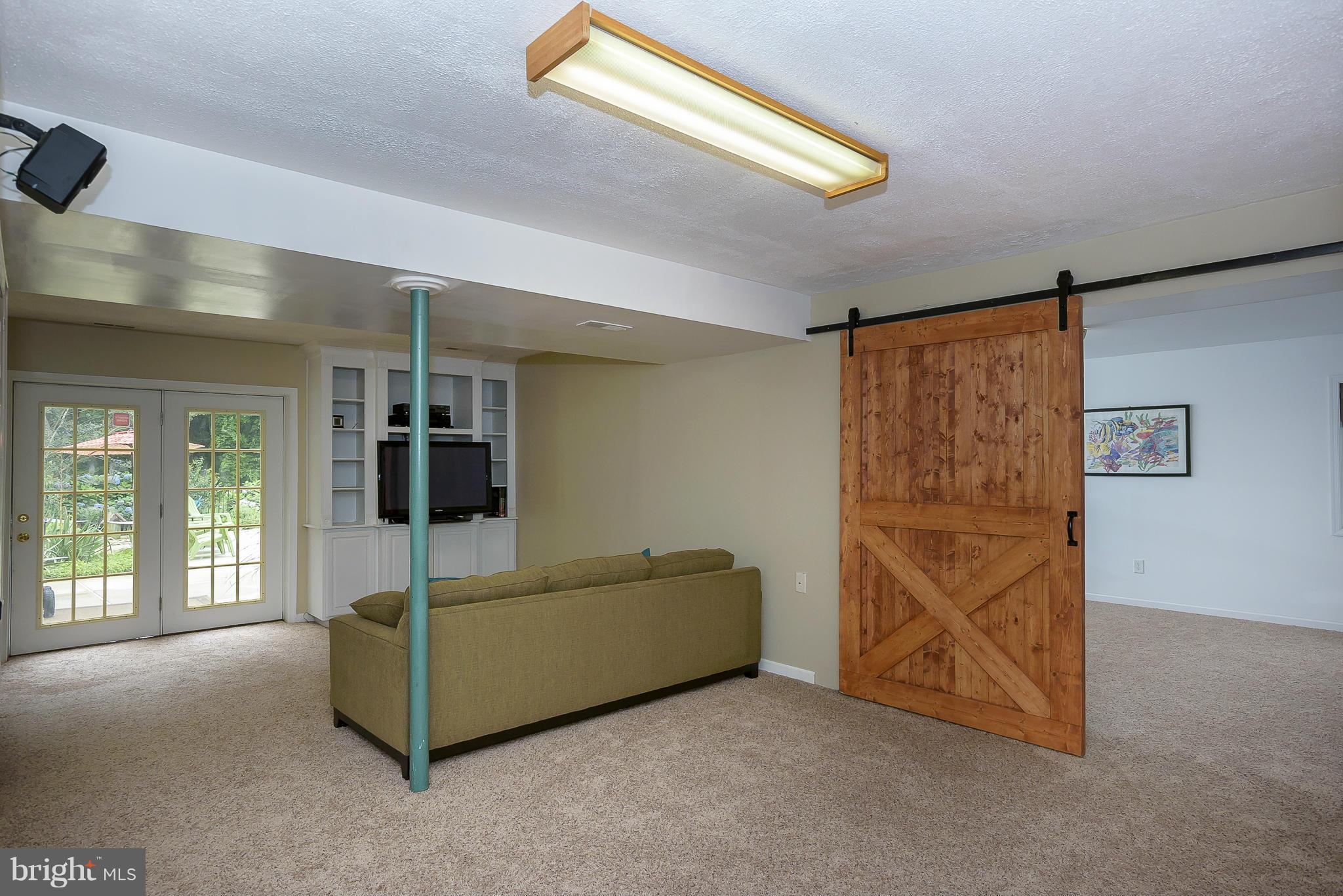 1202 Jones Station Road Arnold, MD 21012 - Photo 18 of 30 Rec Room has new carpet & built-ins.