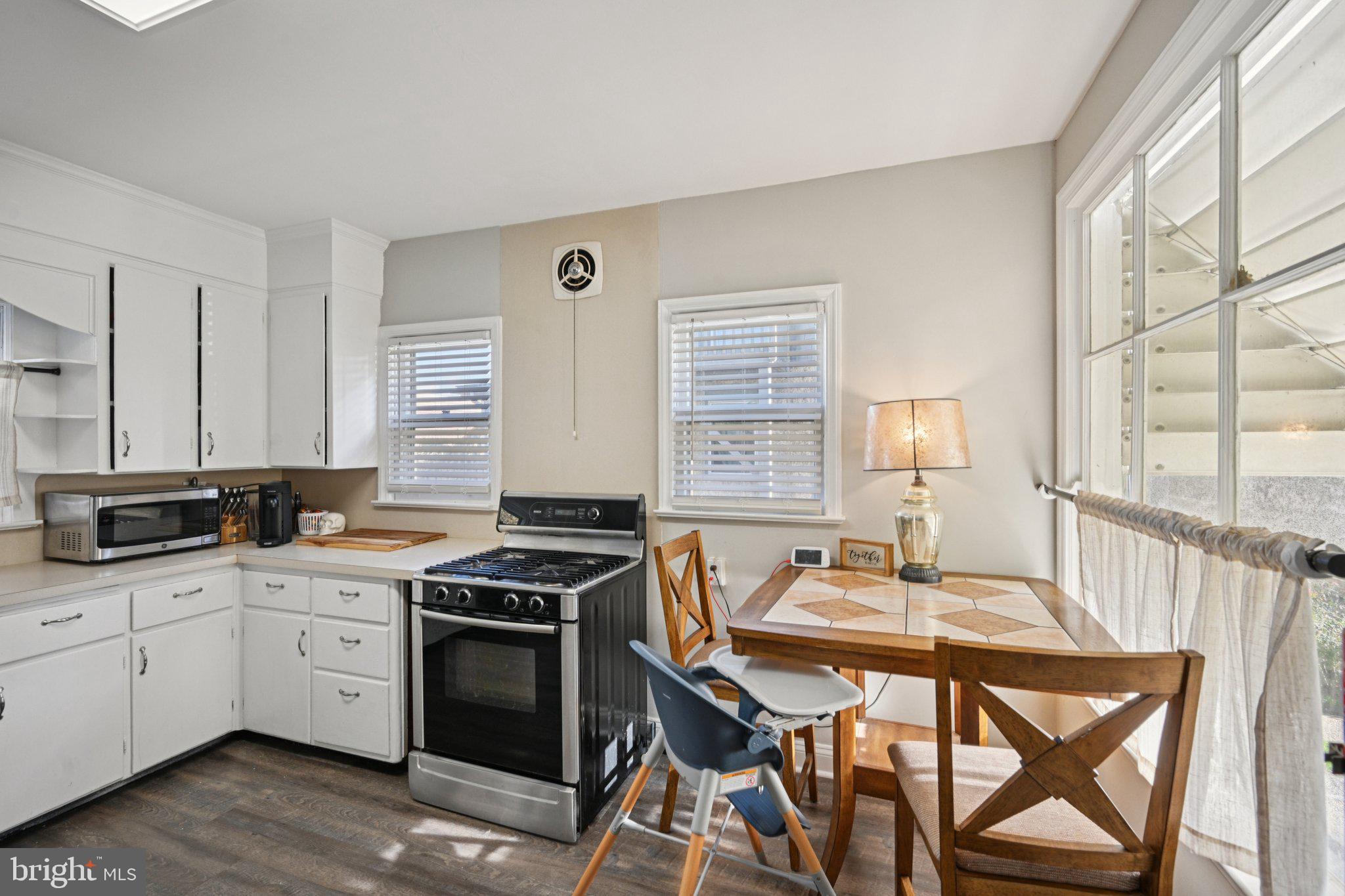 127 7th Avenue Haddon Heights, NJ 08035 - Photo 12 of 47 a kitchen with a stove a sink and cabinets