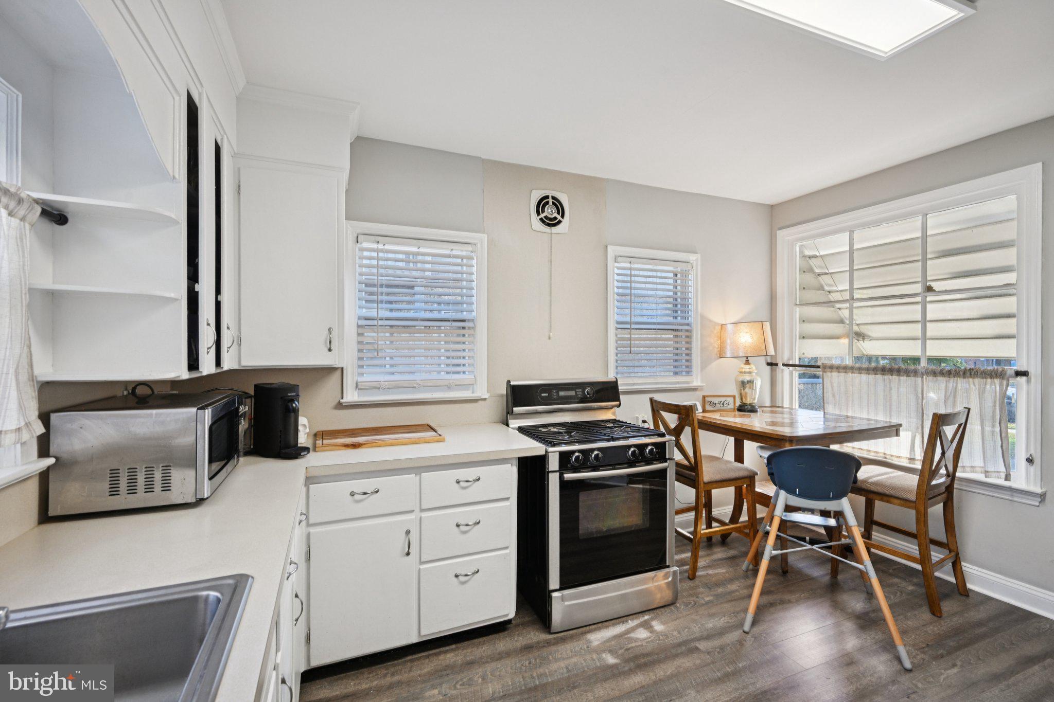 127 7th Avenue Haddon Heights, NJ 08035 - Photo 13 of 47 a kitchen that has a stove and a table in it