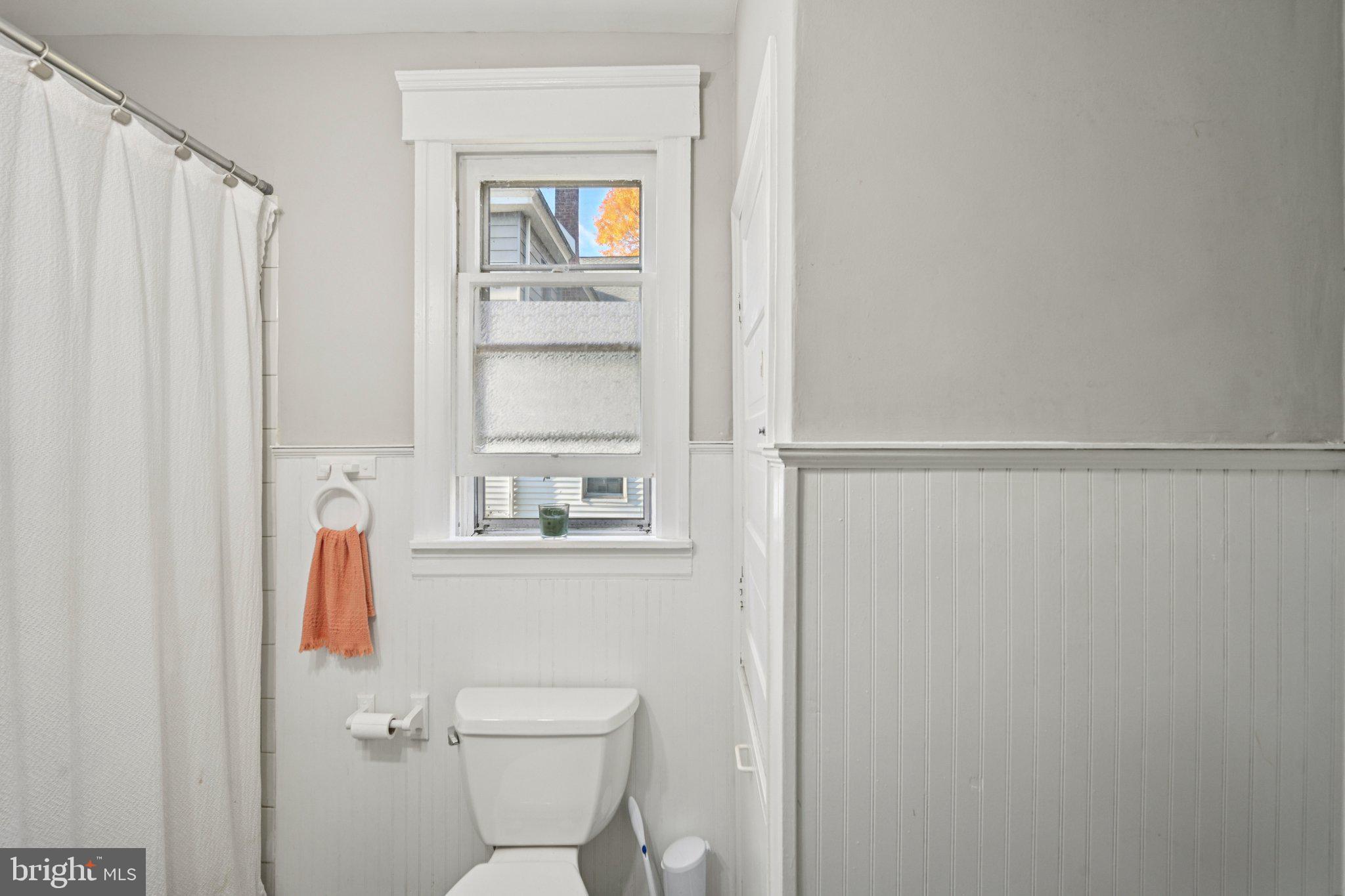 127 7th Avenue Haddon Heights, NJ 08035 - Photo 19 of 47 a bathroom with a toilet and a shower curtain