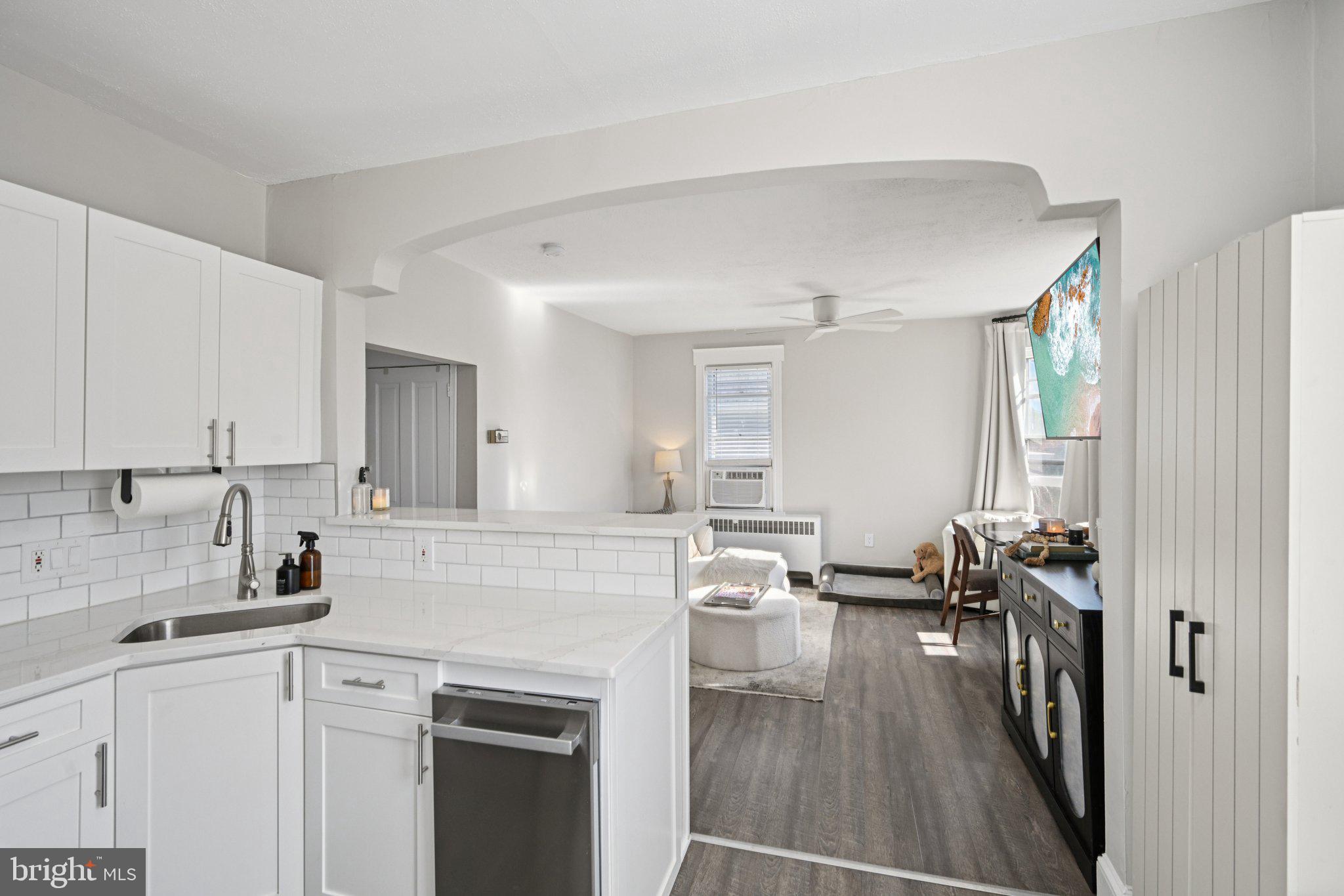 127 7th Avenue Haddon Heights, NJ 08035 - Photo 30 of 47 a kitchen with sink cabinets and wooden floor