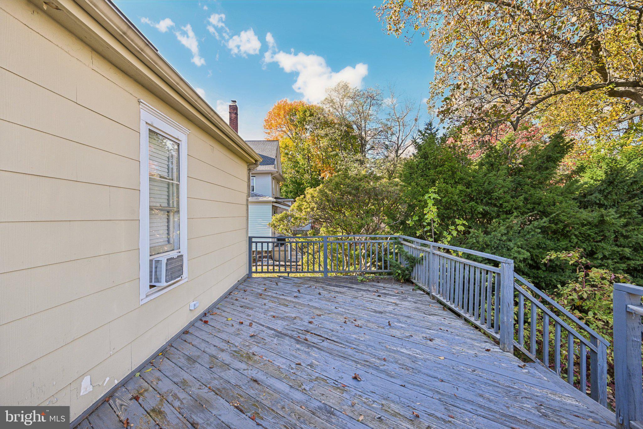 127 7th Avenue Haddon Heights, NJ 08035 - Photo 42 of 47 a view of a porch with wooden floor and fence