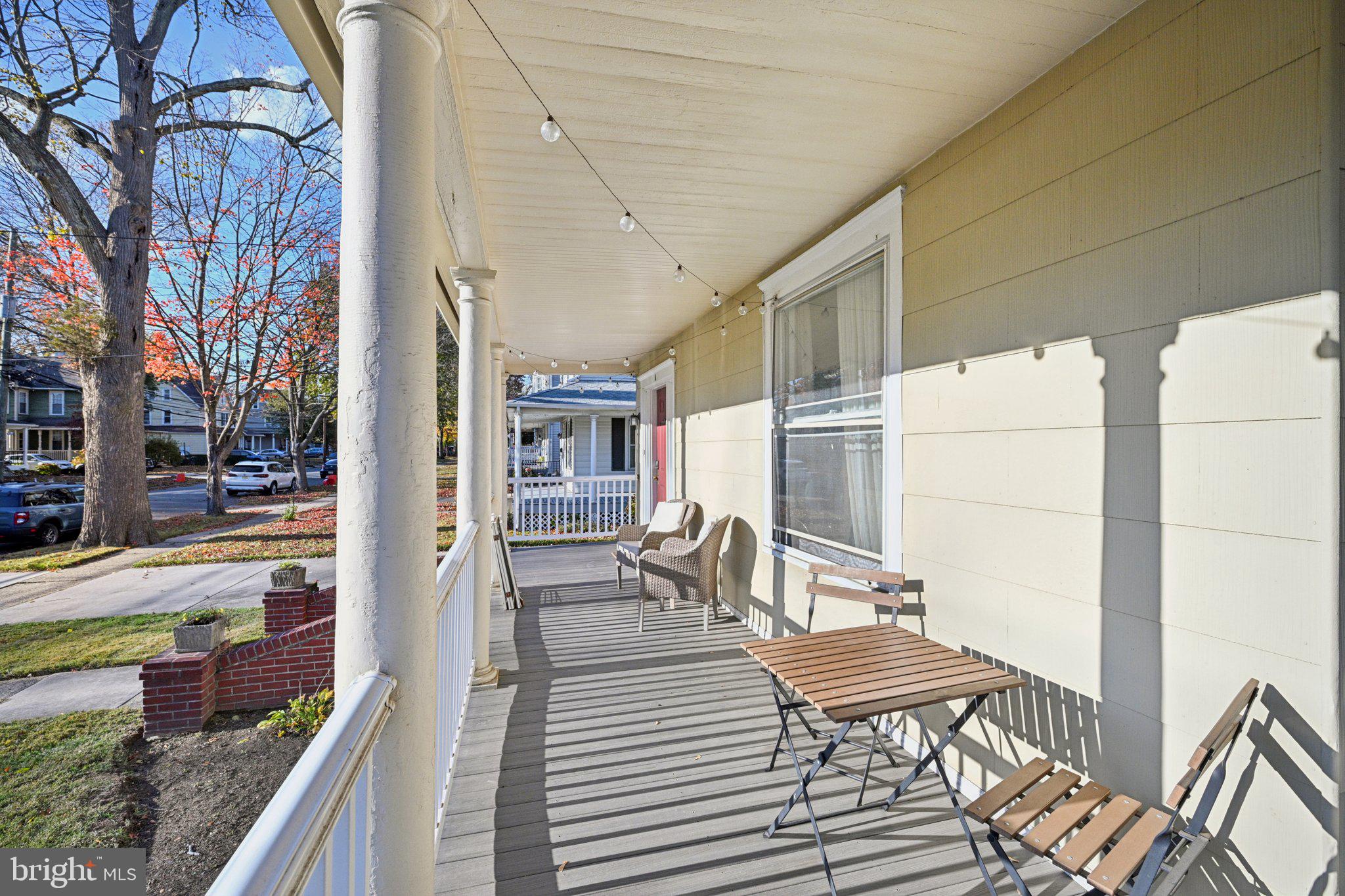 127 7th Avenue Haddon Heights, NJ 08035 - Photo 7 of 47 a balcony with chairs and wooden floor
