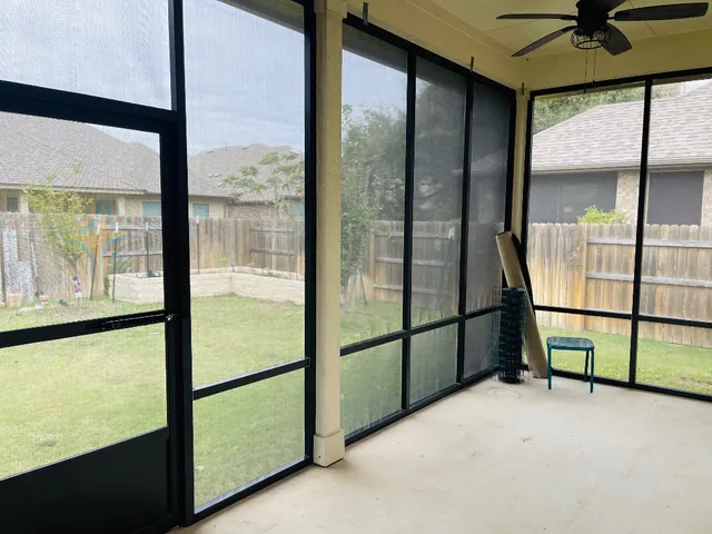 a view of an empty room with a window