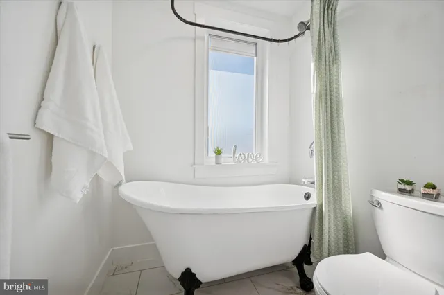 a bathroom with a double vanity sink mirror and shower