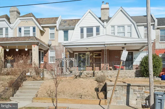 a view of a balcony with furniture and glass doors