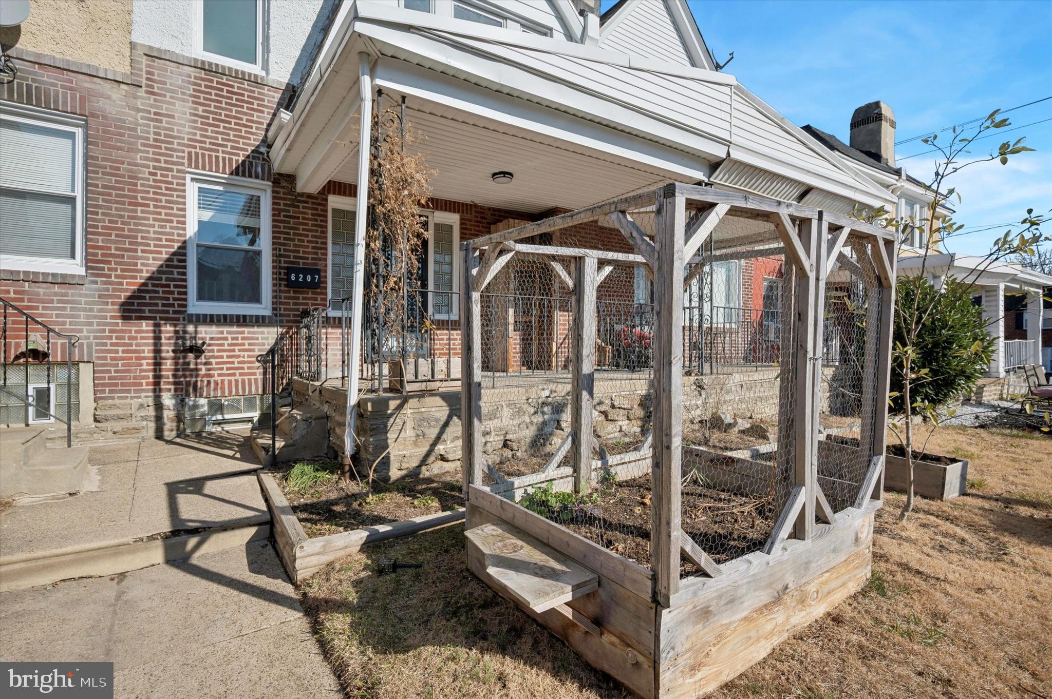6207 Homer Street Philadelphia, PA 19144 - Photo 4 of 26 a view of a balcony with furniture and glass doors