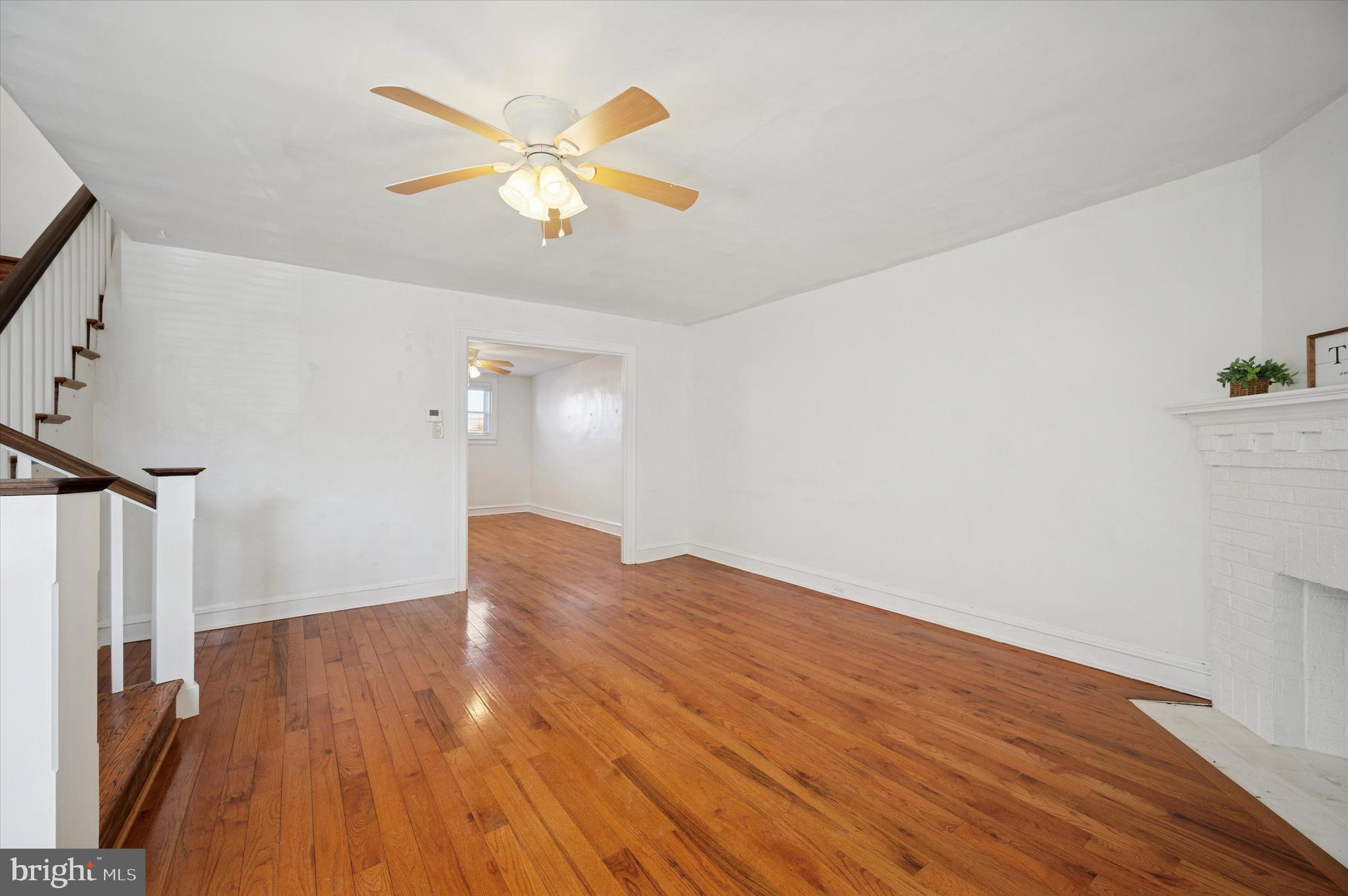 6207 Homer Street Philadelphia, PA 19144 - Photo 8 of 26 wooden floor in an empty room with a window