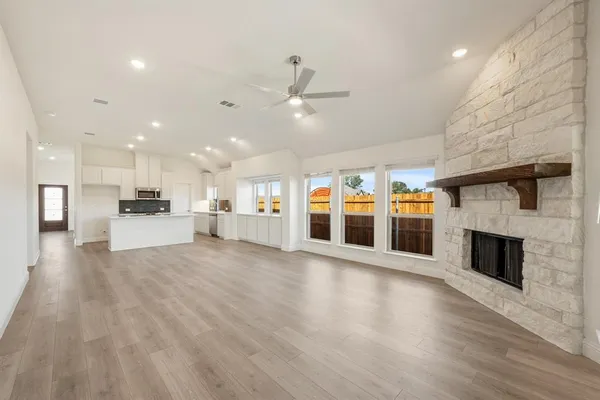 a bedroom with a bed and ceiling fan