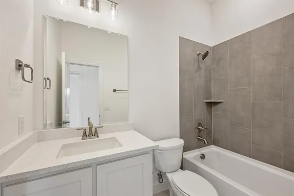 a view of a yard with a house and wooden fence