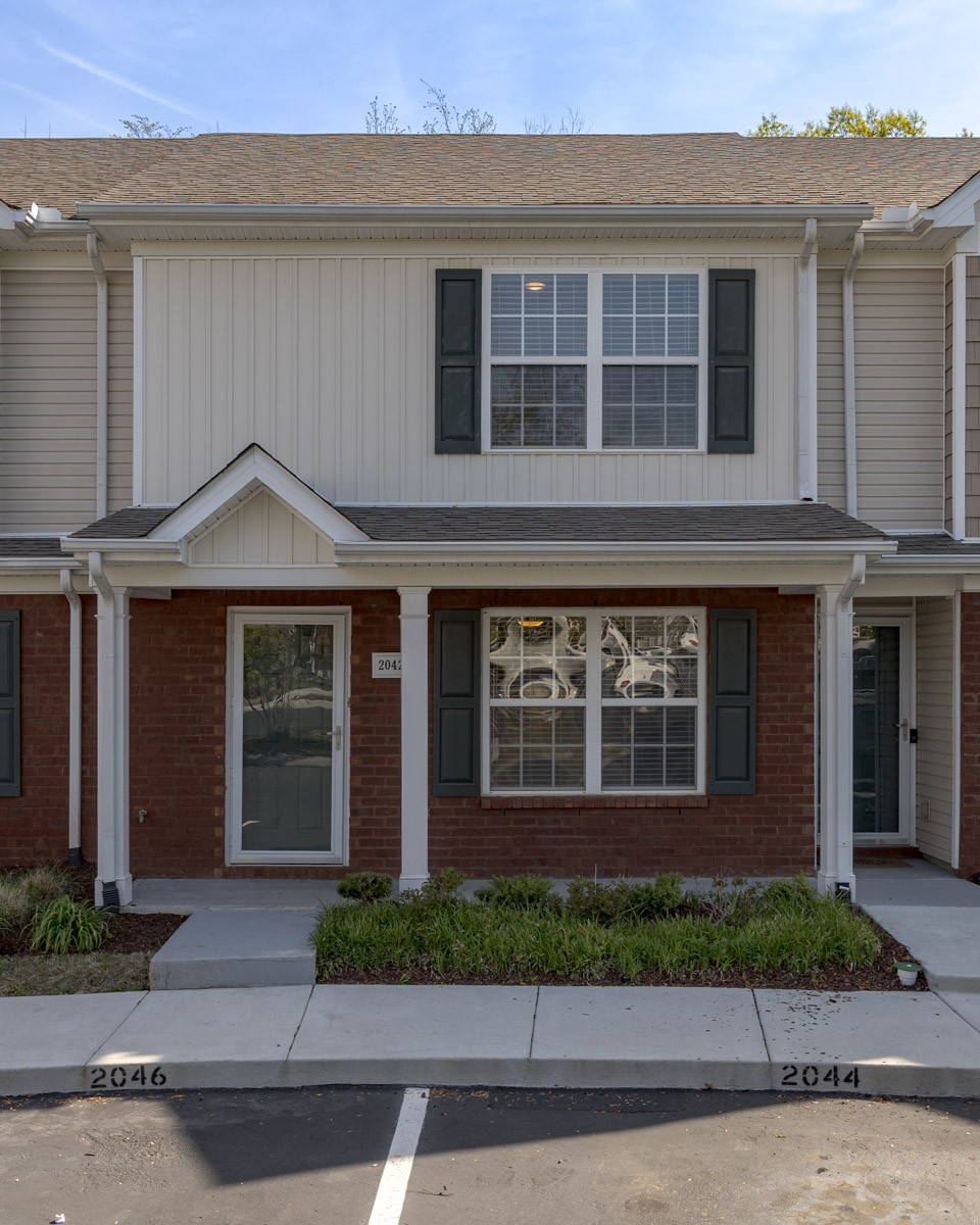 2042 Shaylin Loop Antioch, TN 37013 - Photo 2 of 54 a front view of a house with a yard and garage