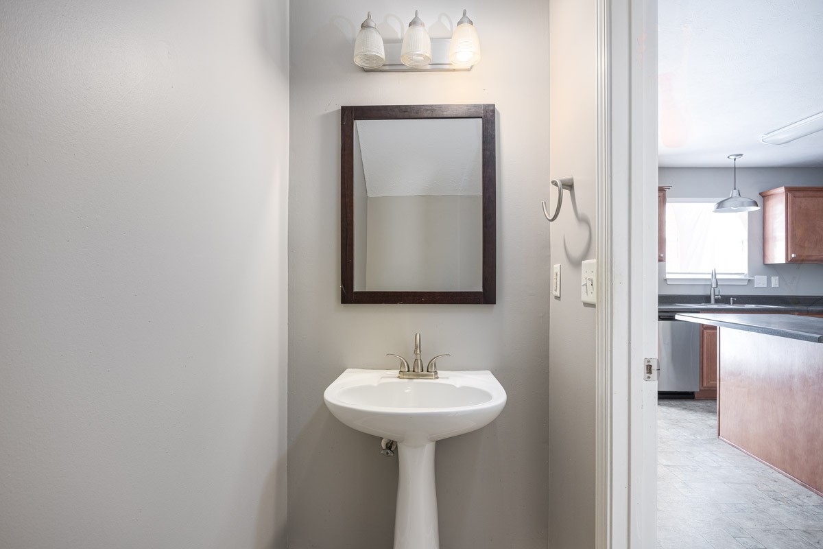 2042 Shaylin Loop Antioch, TN 37013 - Photo 21 of 54 a bathroom with a sink and a mirror