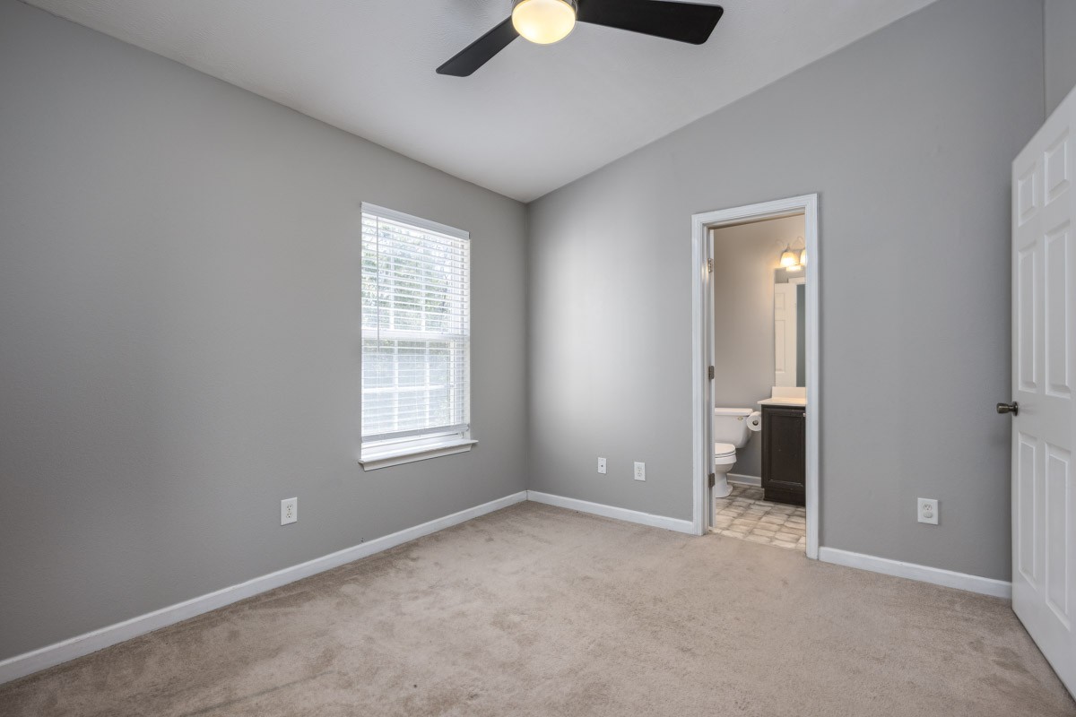 2042 Shaylin Loop Antioch, TN 37013 - Photo 26 of 54 a view of an empty room with a window and a kitchen