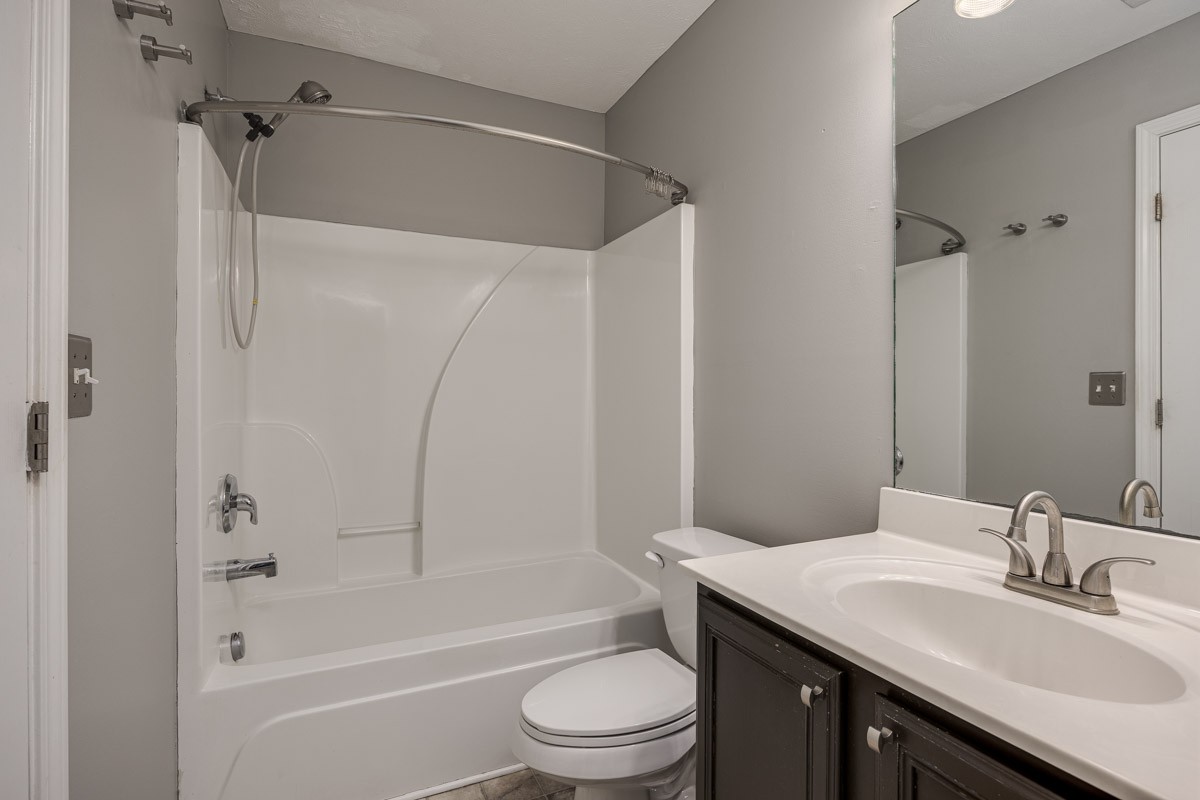 2042 Shaylin Loop Antioch, TN 37013 - Photo 27 of 54 a bathroom with a granite countertop sink toilet and shower