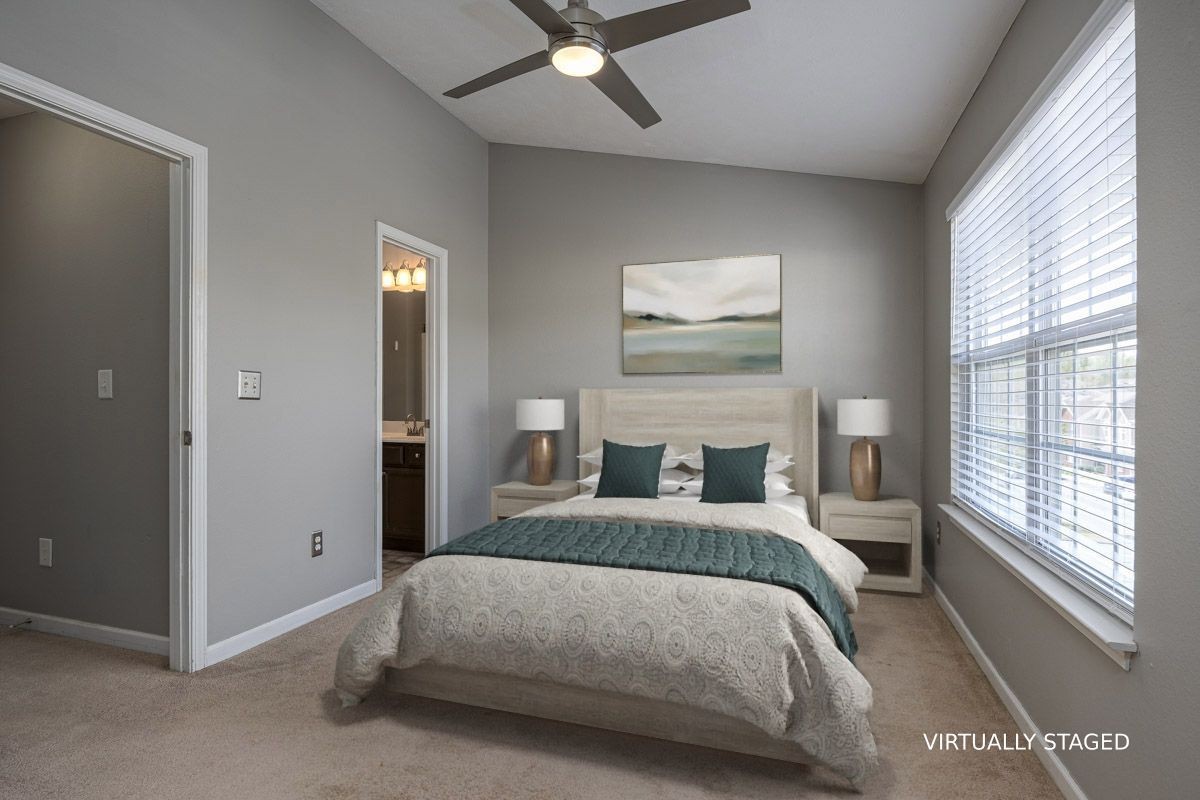 2042 Shaylin Loop Antioch, TN 37013 - Photo 32 of 54 a bedroom with a bed and a large window