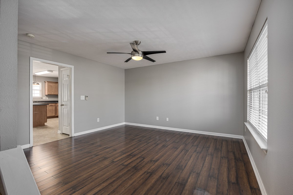 2042 Shaylin Loop Antioch, TN 37013 - Photo 7 of 54 wooden floor in an empty room with a window