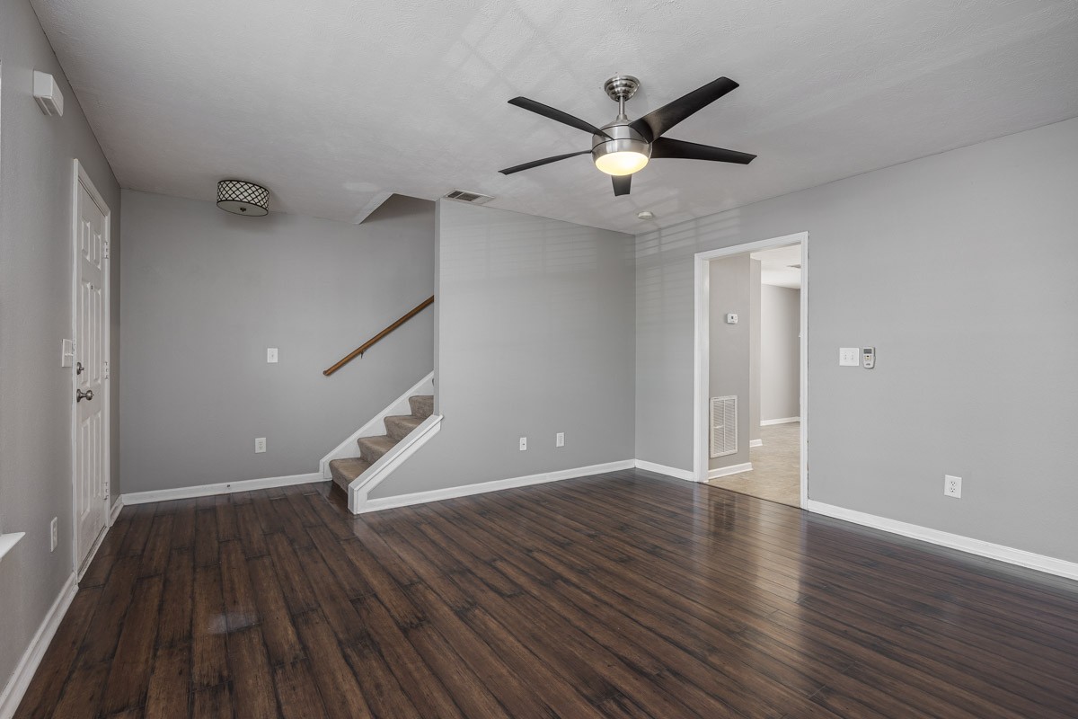 2042 Shaylin Loop Antioch, TN 37013 - Photo 8 of 54 a view of an empty room with wooden floor and a ceiling fan