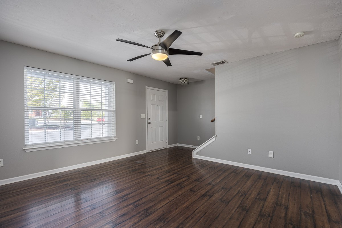 2042 Shaylin Loop Antioch, TN 37013 - Photo 9 of 54 an empty room with wooden floor fan and windows
