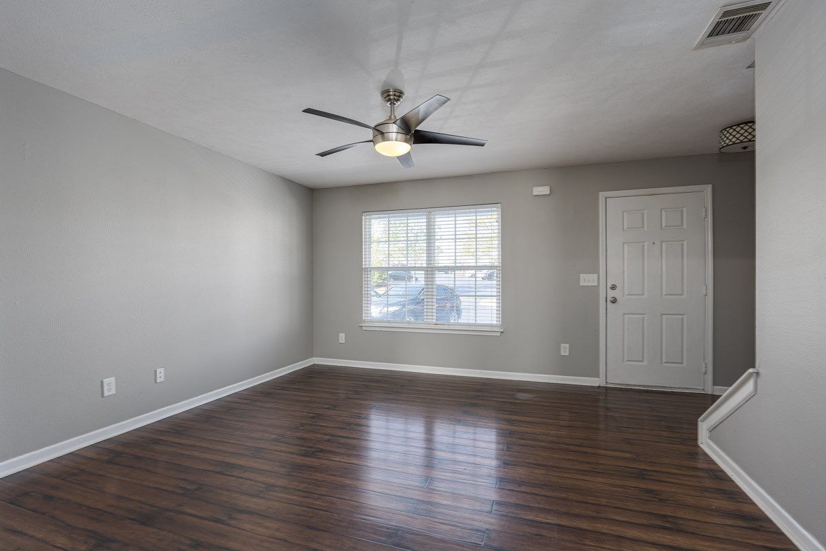 2042 Shaylin Loop Antioch, TN 37013 - Photo 10 of 54 wooden floor in an empty room with a window