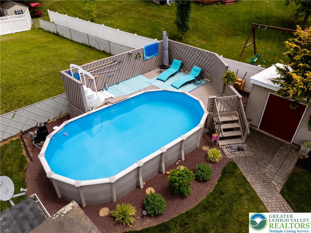 2087 Hopewell Road Bethlehem, PA 18017 - Photo 37 of 38 An inviting above-ground pool with a spacious deck offers a private outdoor oasis.