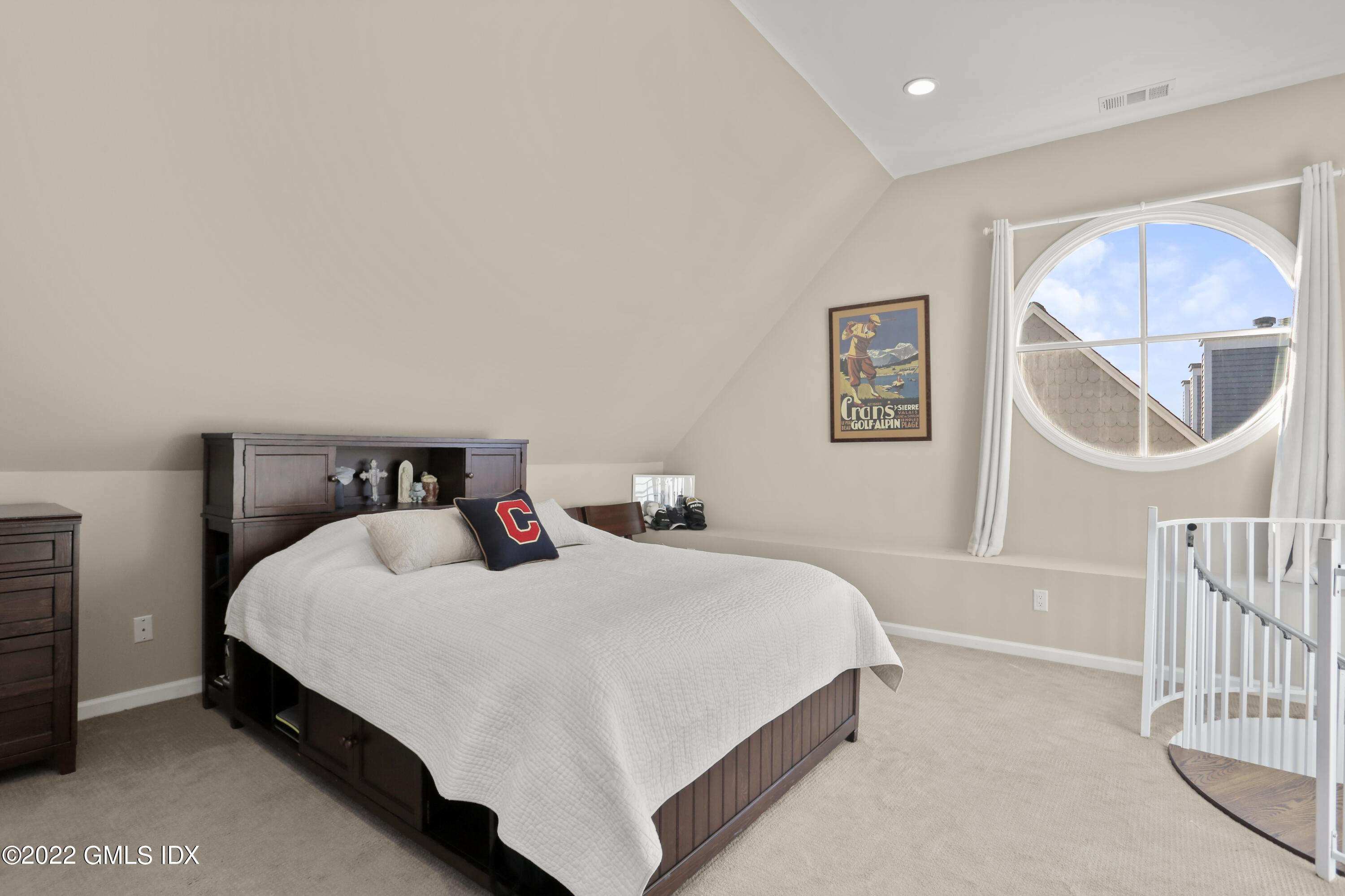 186 Field Point Road, Unit 6A Greenwich, CT 06830 - Photo 17 of 25 a bedroom with a bed a painting on the wall and a window