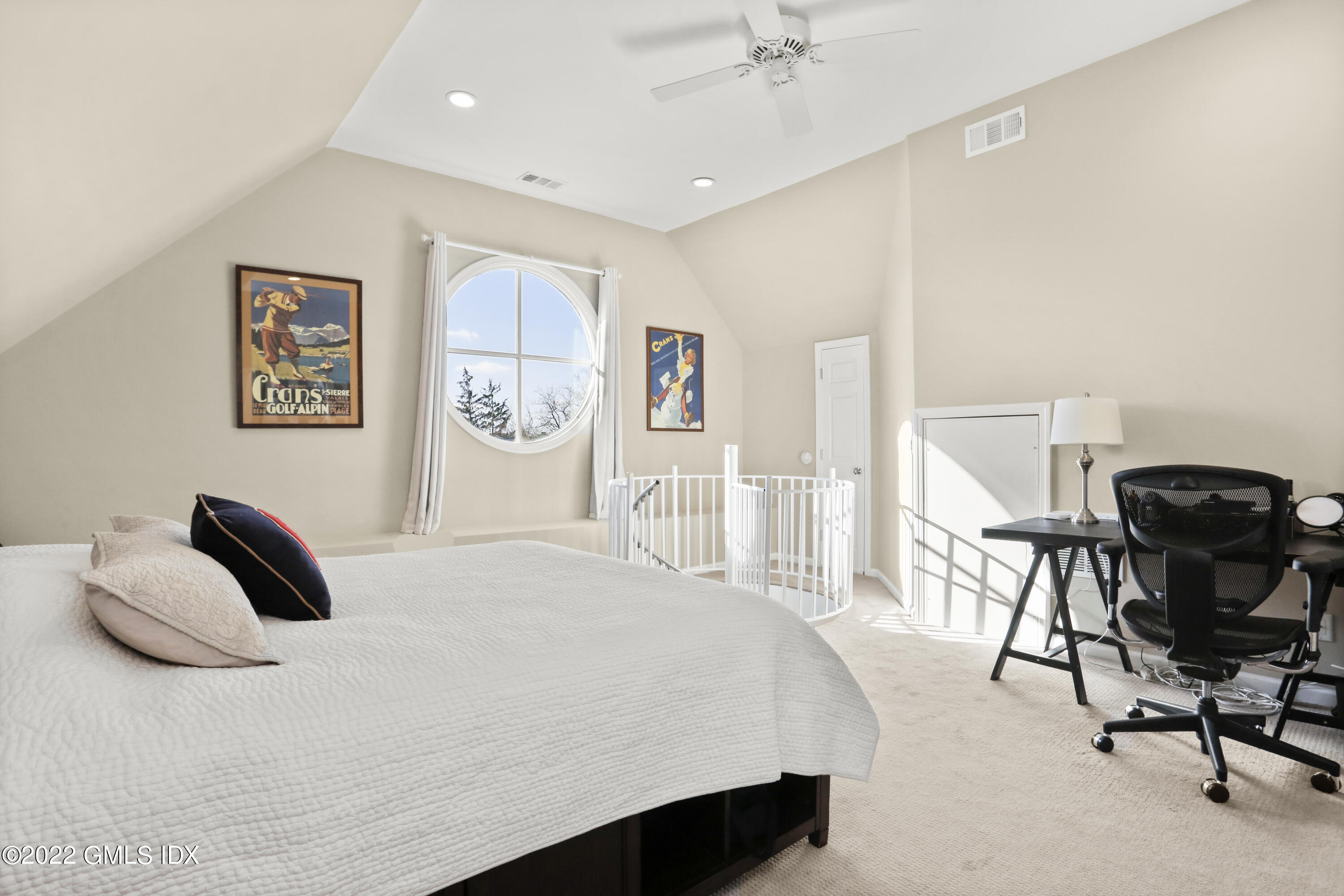 186 Field Point Road, Unit 6A Greenwich, CT 06830 - Photo 18 of 25 a bedroom with a bed and a chair in it