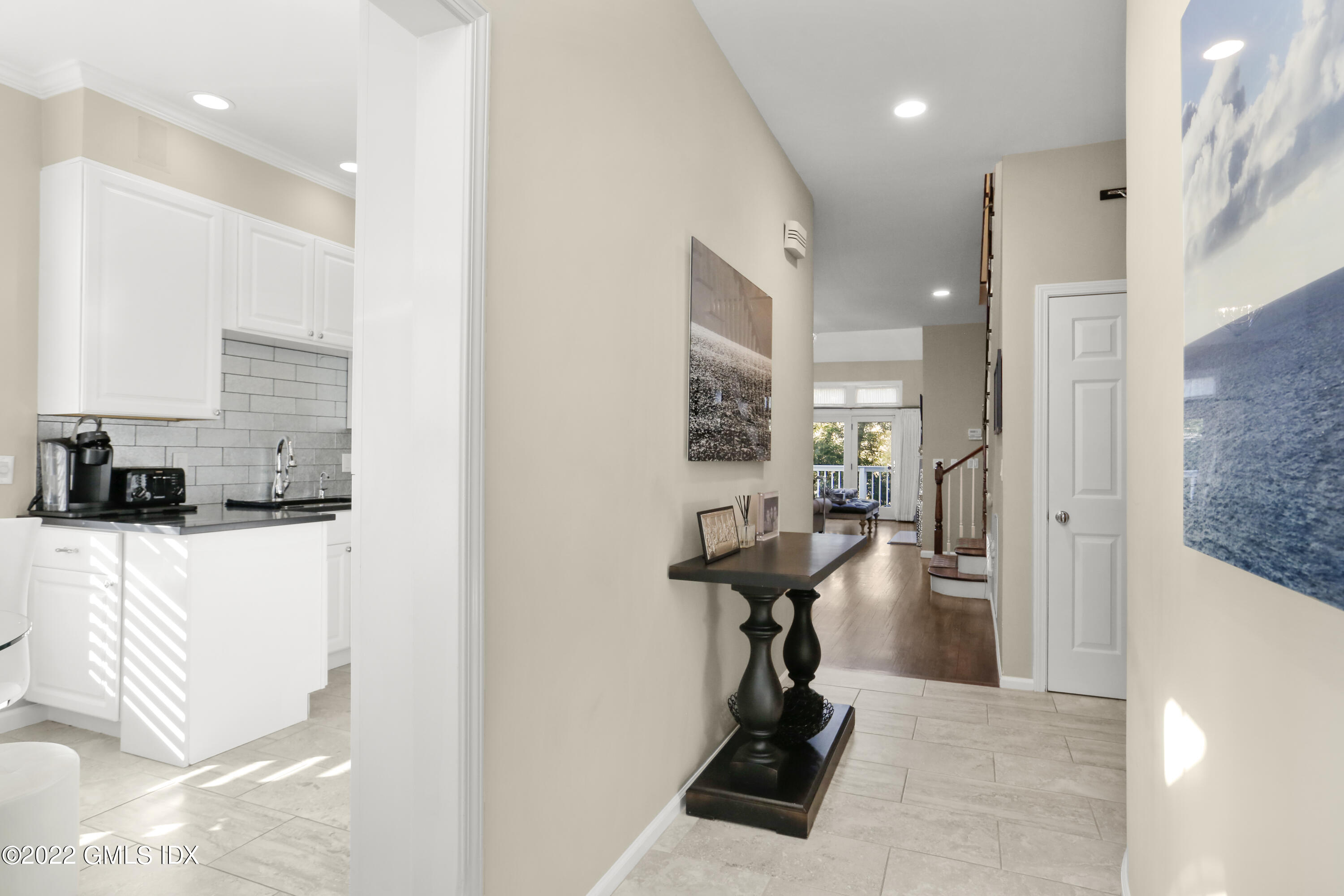 186 Field Point Road, Unit 6A Greenwich, CT 06830 - Photo 2 of 25 a view of a living room and bathroom