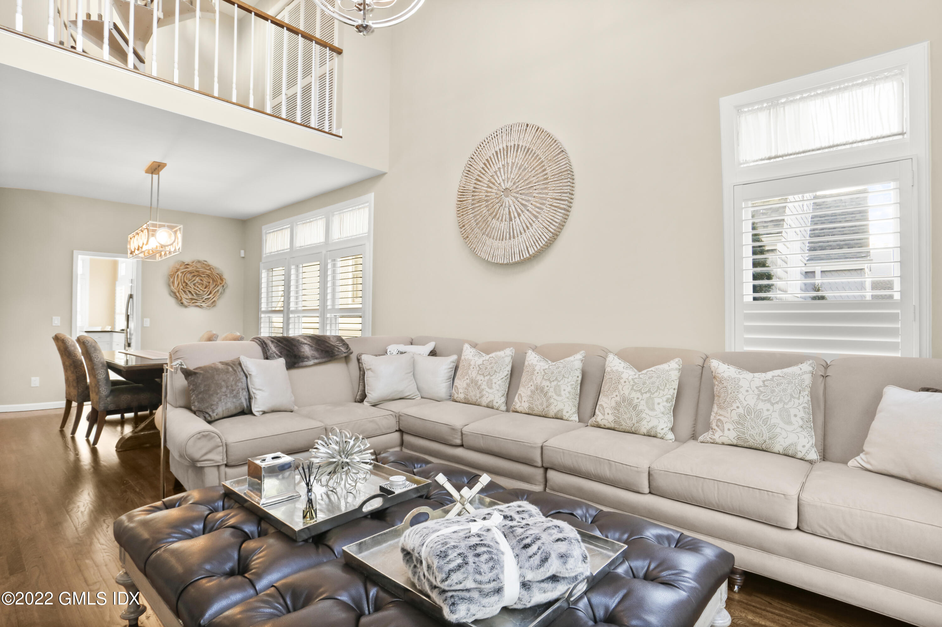 186 Field Point Road, Unit 6A Greenwich, CT 06830 - Photo 6 of 25 a living room with furniture a rug and a window