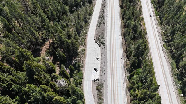 a view of a park with iron fence