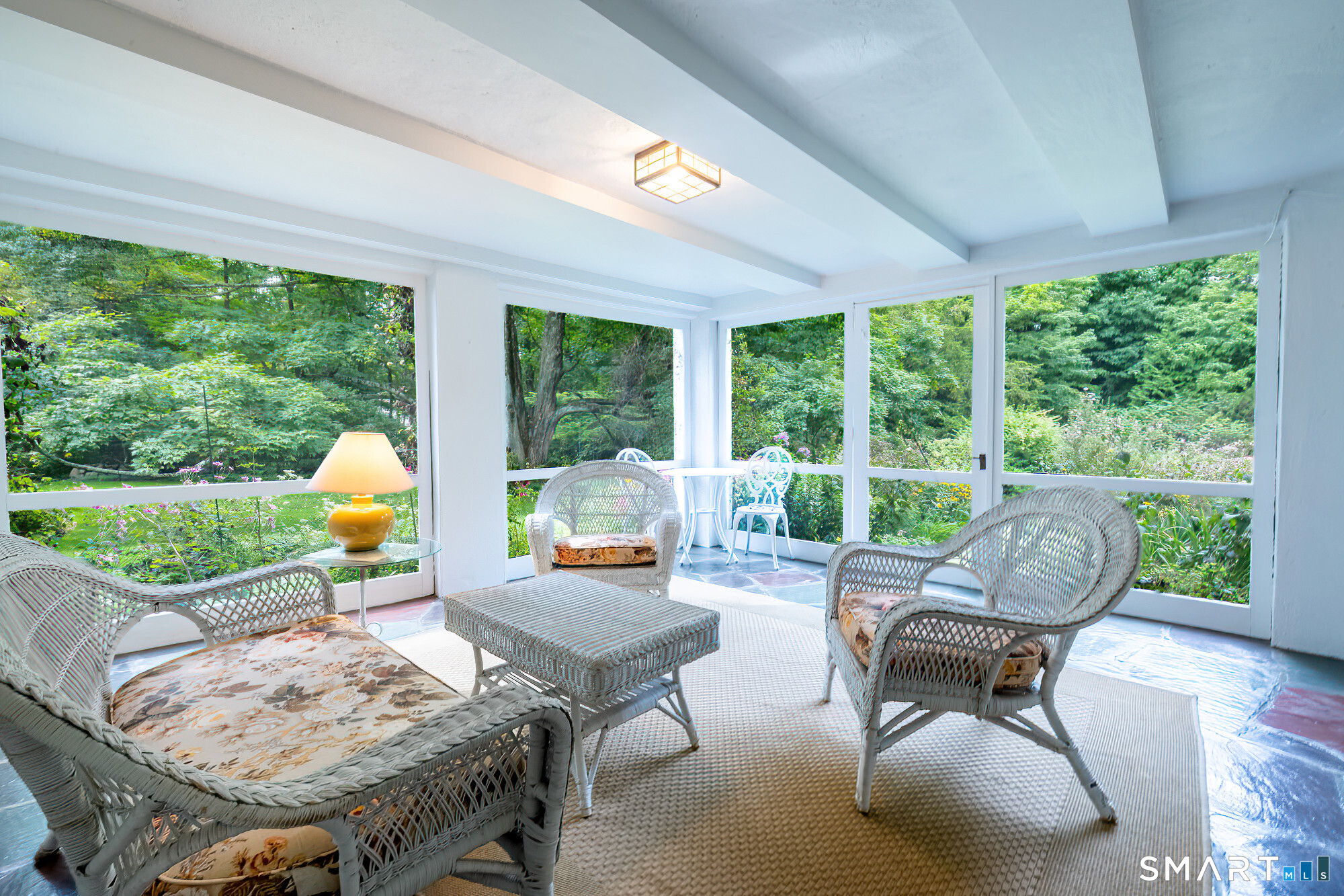 3 Blackman Road Ridgefield, CT 06877 - Photo 30 of 40 A screen porch with stone floor right off the family room