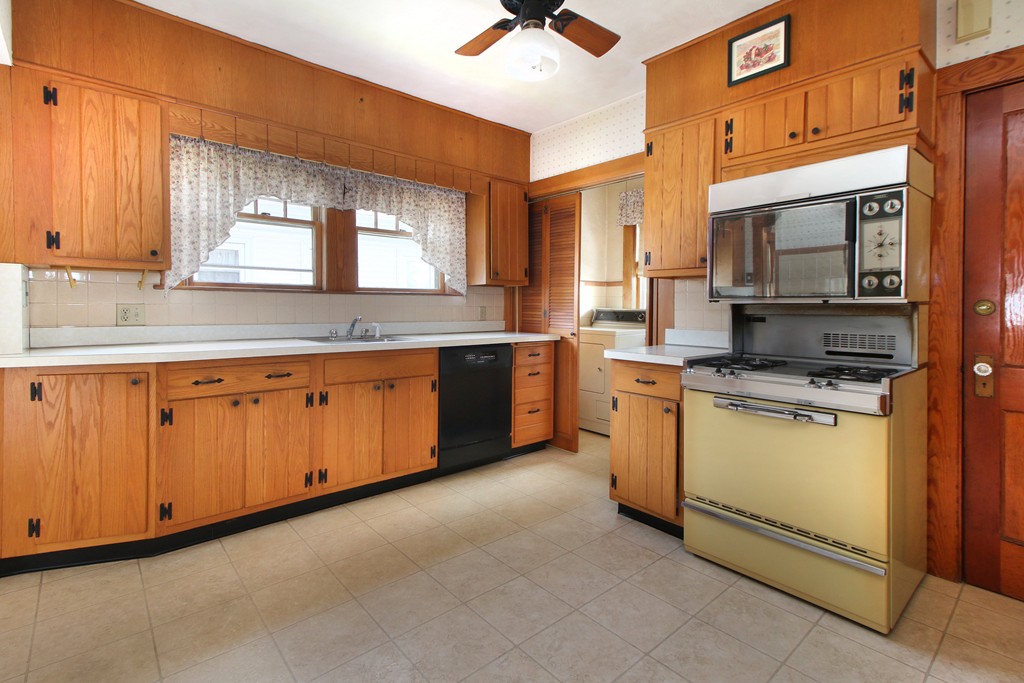 58-60 Matignon Road Cambridge, MA 02140 - Photo 12 of 16 a kitchen with a sink cabinets and window
