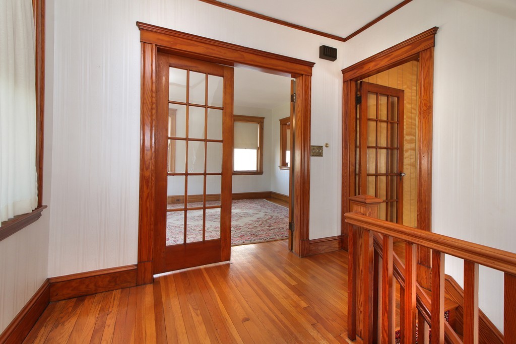 58-60 Matignon Road Cambridge, MA 02140 - Photo 9 of 16 a view of entryway with wooden floor
