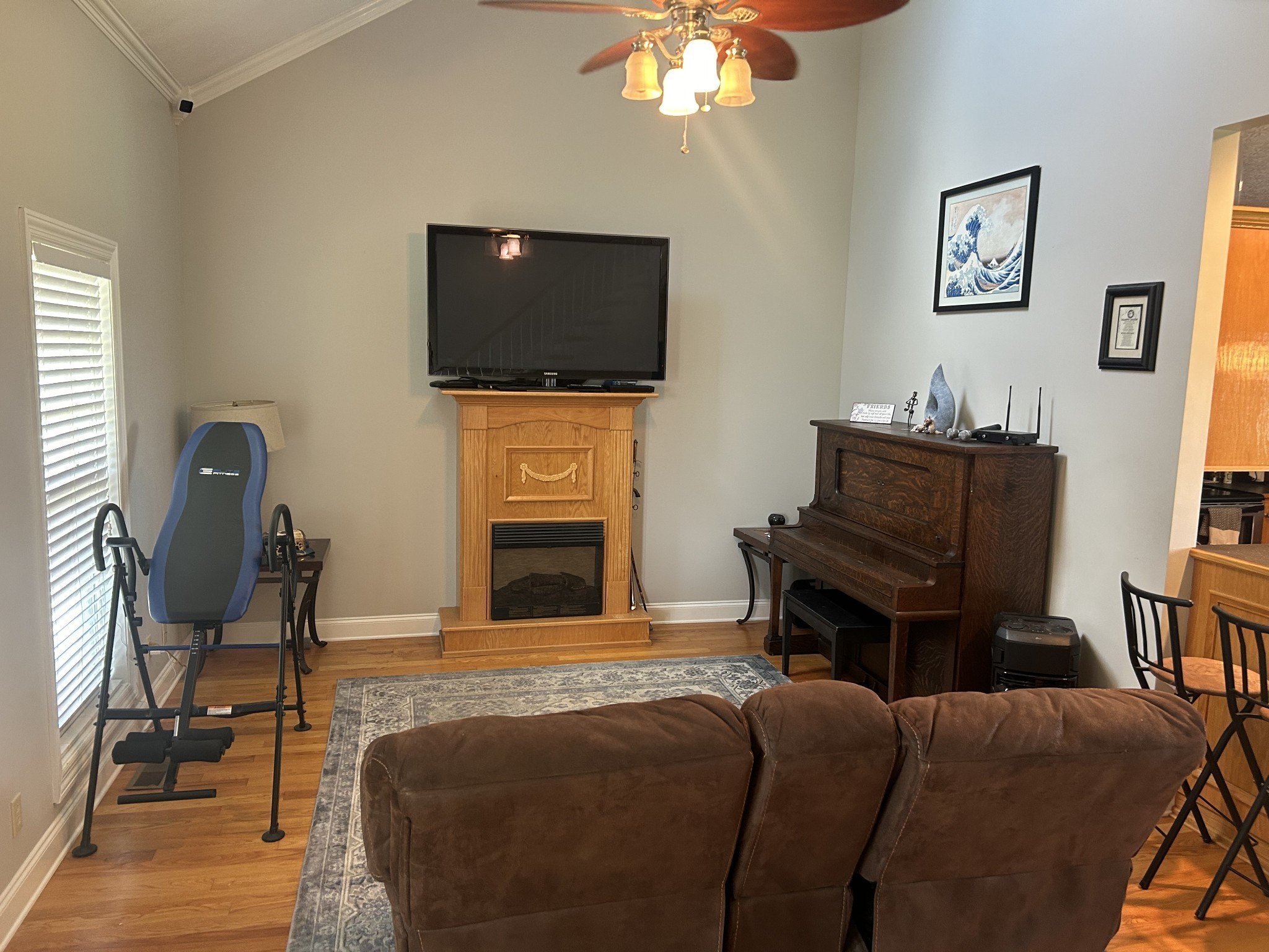 3421 George Olive Road Iron City, TN 38463 - Photo 16 of 51 a living room with furniture a flat screen tv and kitchen view