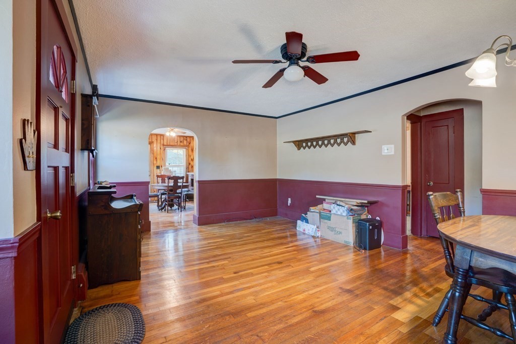 210 Belchertown Road Ware, MA 01082 - Photo 15 of 25 a living room with furniture and a wooden floor