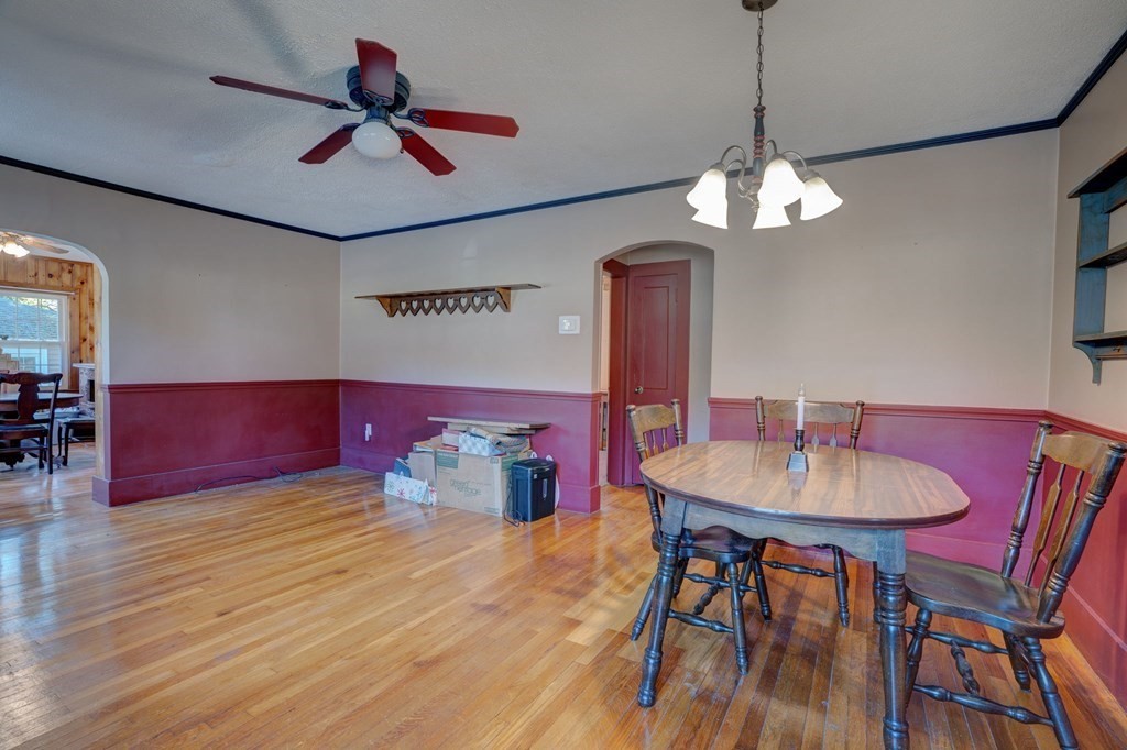 210 Belchertown Road Ware, MA 01082 - Photo 16 of 25 a view of a dining room with furniture a chandelier and wooden floor