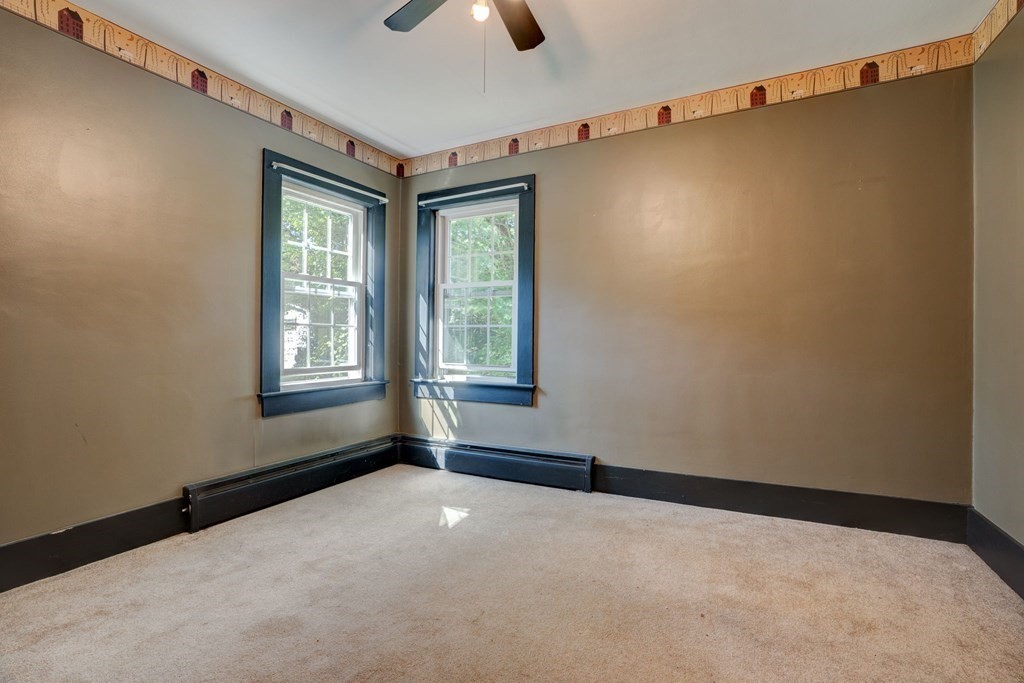 210 Belchertown Road Ware, MA 01082 - Photo 21 of 25 an empty room with windows and fan