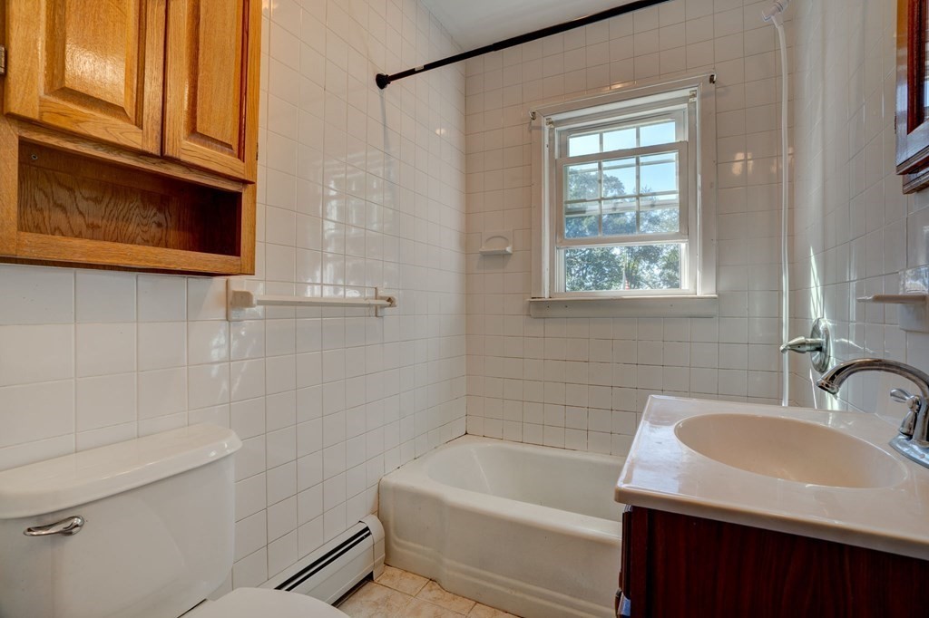 210 Belchertown Road Ware, MA 01082 - Photo 25 of 25 a bathroom with a sink a bathtub and a window