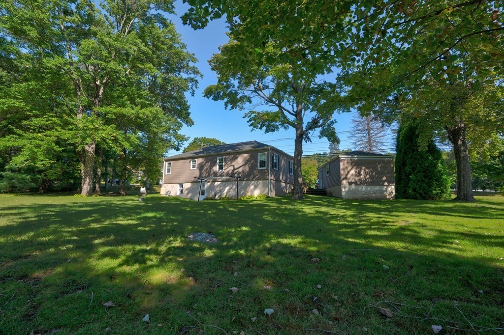 210 Belchertown Road Ware, MA 01082 - Photo 9 of 25 a view of a trees in a yard with a house in the background