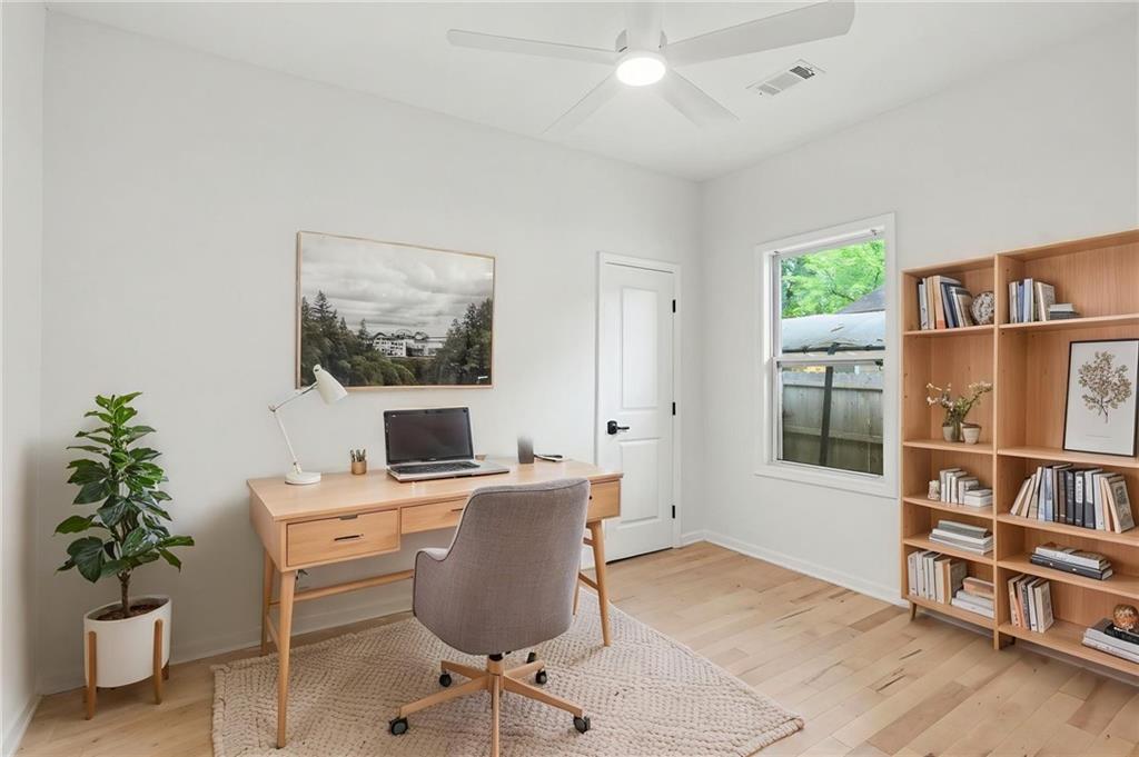 827 Elbert Street Southwest Atlanta, GA 30310 - Photo 13 of 33 a workspace with furniture window and wooden floor