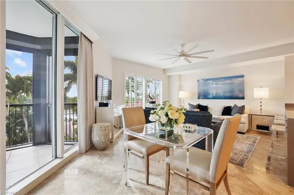 a dining room with furniture and window